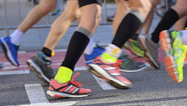 legs running in colourful socks & trainers